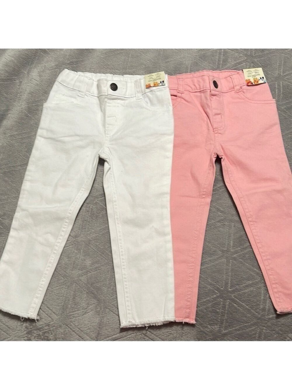 2 pairs of girl jeans